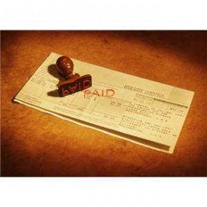 Bills with rubber stamp that have been stamped Paid
