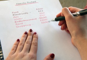 Hands of woman making a budget