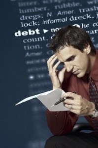 man looking at report with word debt in background
