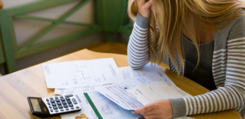 frustrated woman figuring out her budget