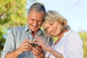 Mature couple looking at a calculator