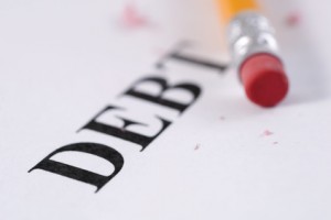 Eraser side of pencil next to word Debt