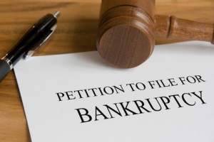 Gavel, pen and document titled Petition To File For Bankruptcy