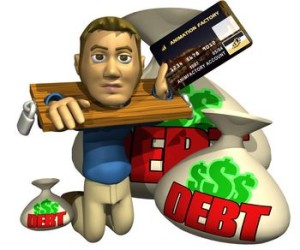 man shackled holding a credit card and surrounded by debt