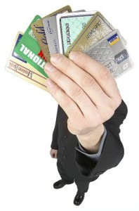man holding multiple credit cards