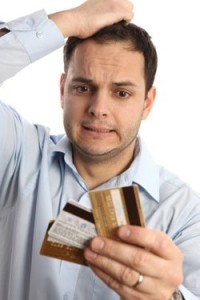 man holding multiple credit cards
