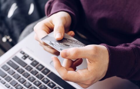 person using a credit card