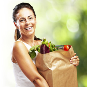 happy woman with groceries