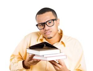 young man holding empty wallet and books