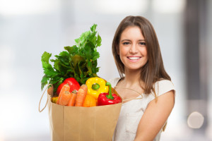 woman with a full grocery shopping bag