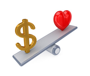 dollar and heart on a seesaw