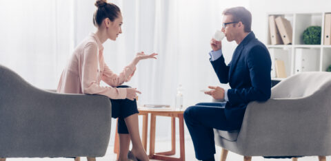man and woman discussing financial advice