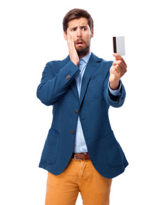 worried man holding a credit card