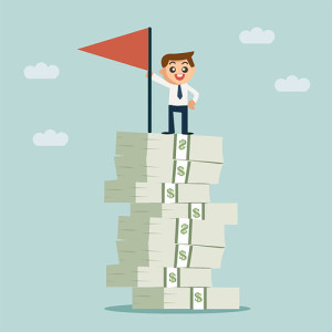 businessman standing on a stack of money