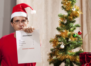 Santa man looking at holiday debt