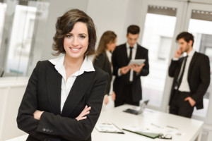 businesswoman with colleagues in the background