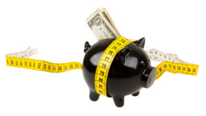 black piggy bank with tape measure