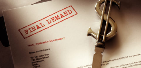 The words "final demand" stamped on a paper