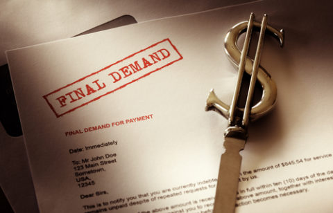 The words "final demand" stamped on a paper