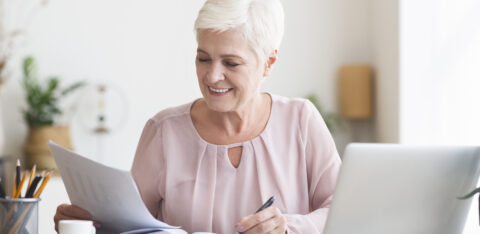 retired woman reviewing finances