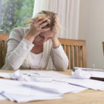 women frustrated in debt with bad credit