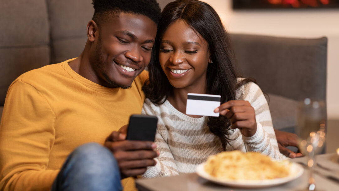 Couple earning credit card rewards points