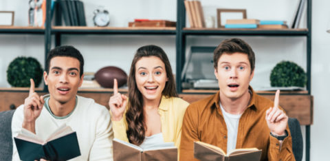 3 people reading books about money management