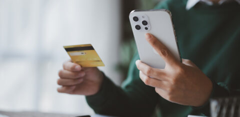 Individuals hold credit cards, pay for goods and services by cre