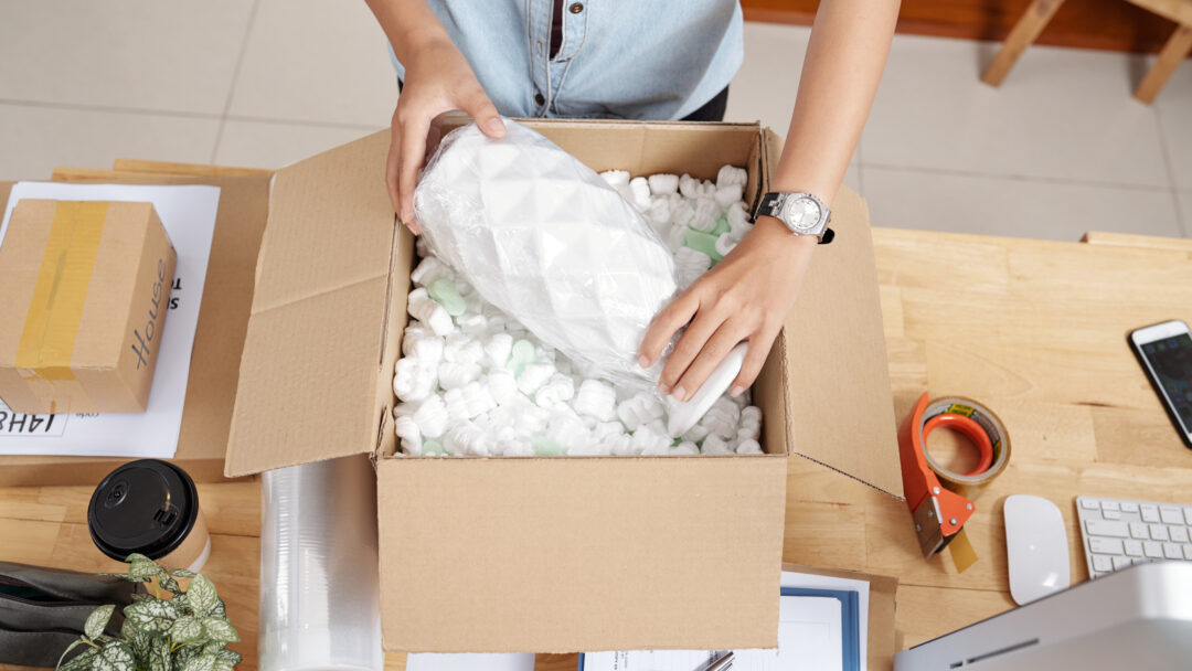 Woman packing vase