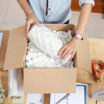 Woman packing vase