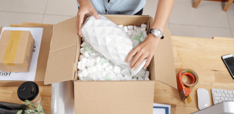 Woman packing vase