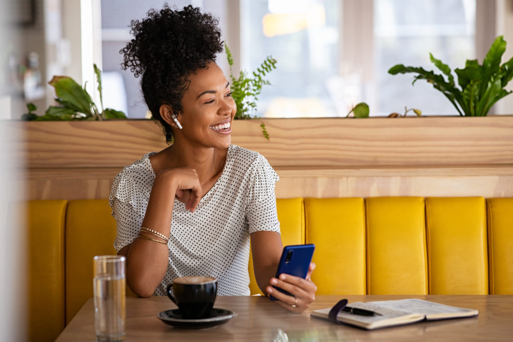 happy woman in cafe talking on the phone with earp 2022 02 15 23 33 52 utc