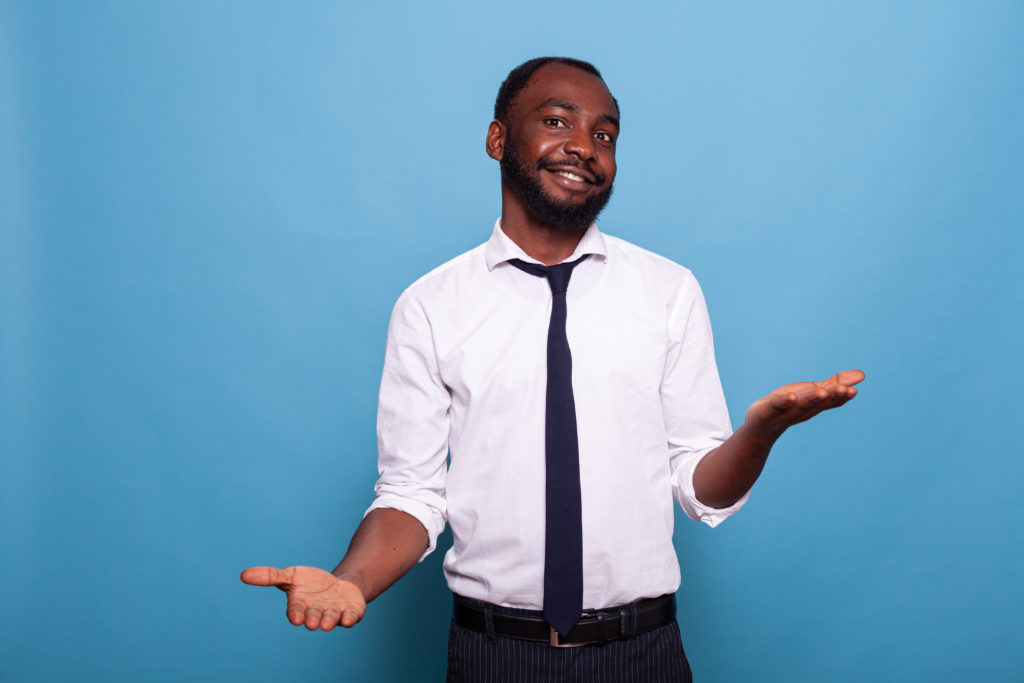 portrait of smiling businessman with open palms we 2022 03 25 18 57 36 utc