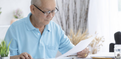 senior man looking at a tax refund