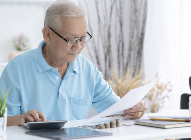 senior man looking at a tax refund