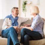 Retired couple discussing finances and debt