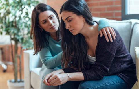 woman comforting her friend