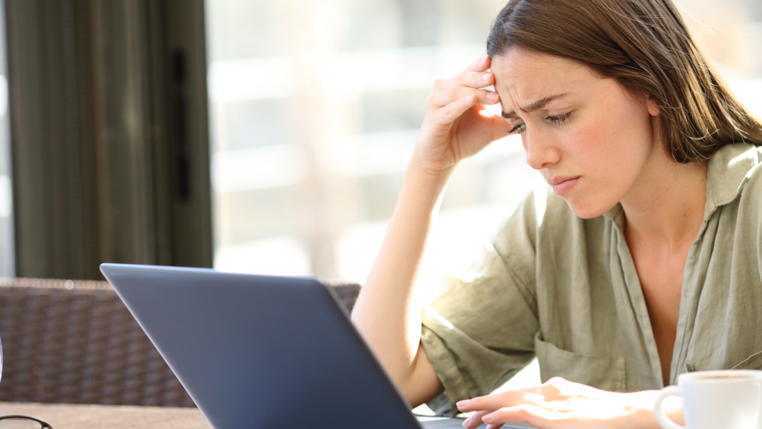 concerned woman looking at computer