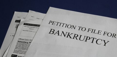Close-up of U.S. bankruptcy forms, including a petition to file for bankruptcy.