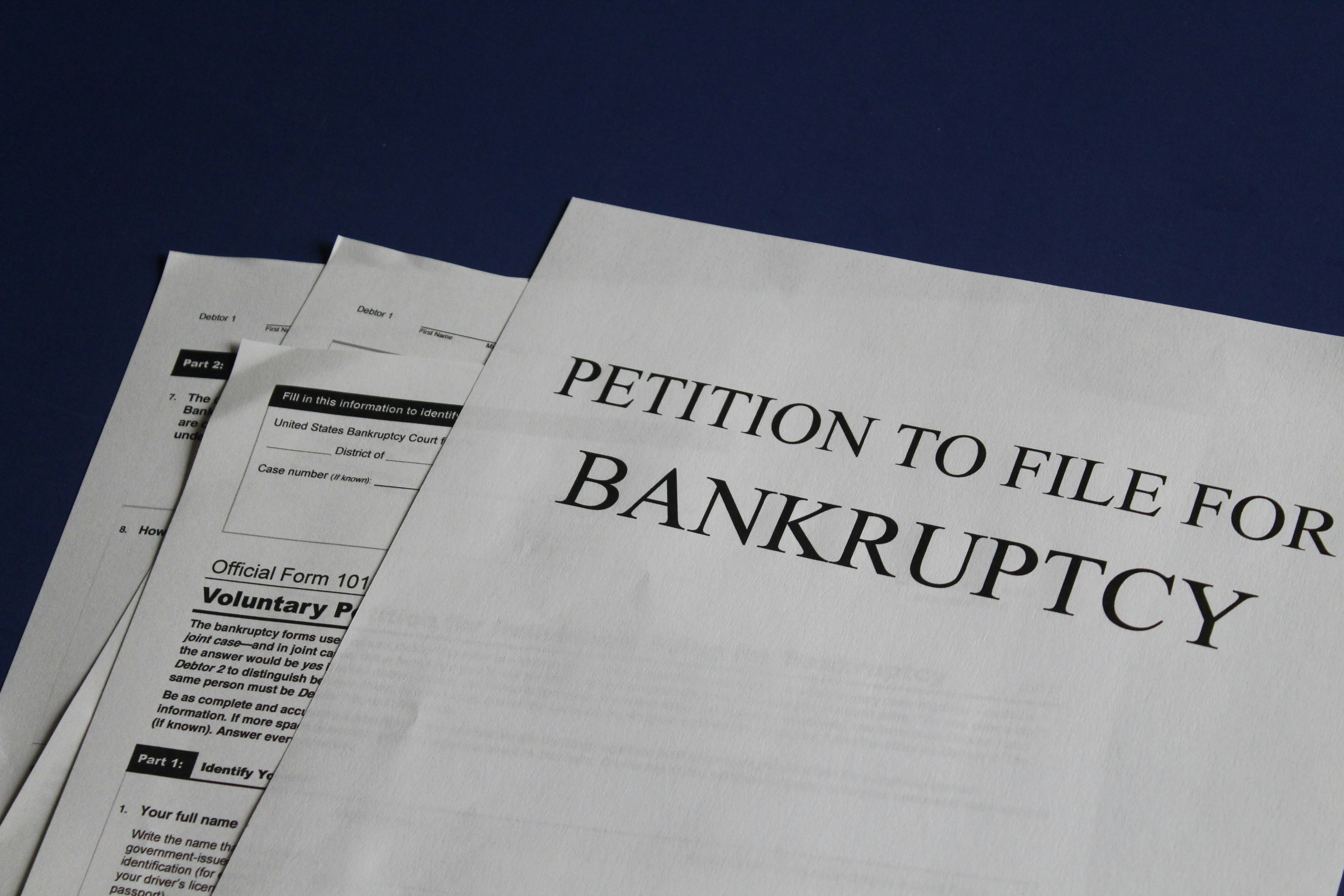Close-up of U.S. bankruptcy forms, including a petition to file for bankruptcy.