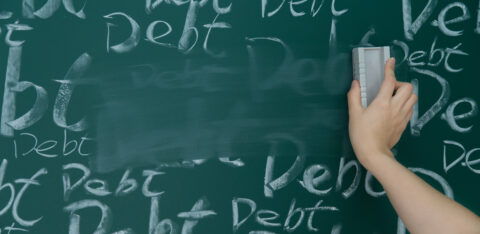 Wiping debt on a chalkboard