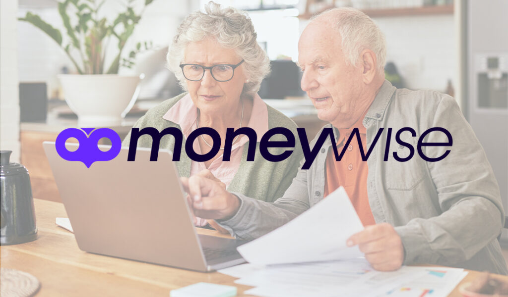 Couple working on finances at home, sitting at a kitchen table with the "moneywise" logo in the foreground.