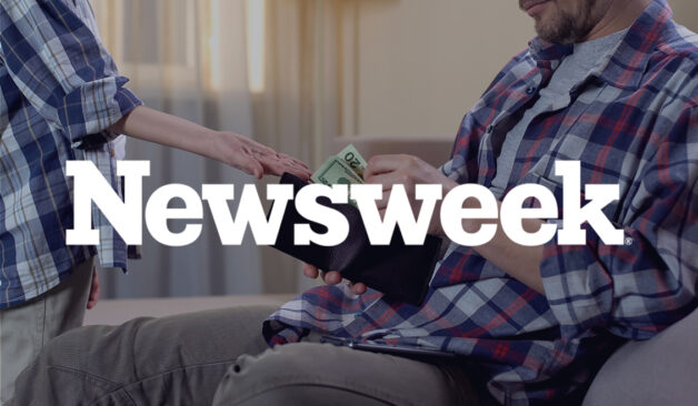 A man sitting on a couch takes cash from his wallet and hands it to a child. The Newsweek logo appears over the image.