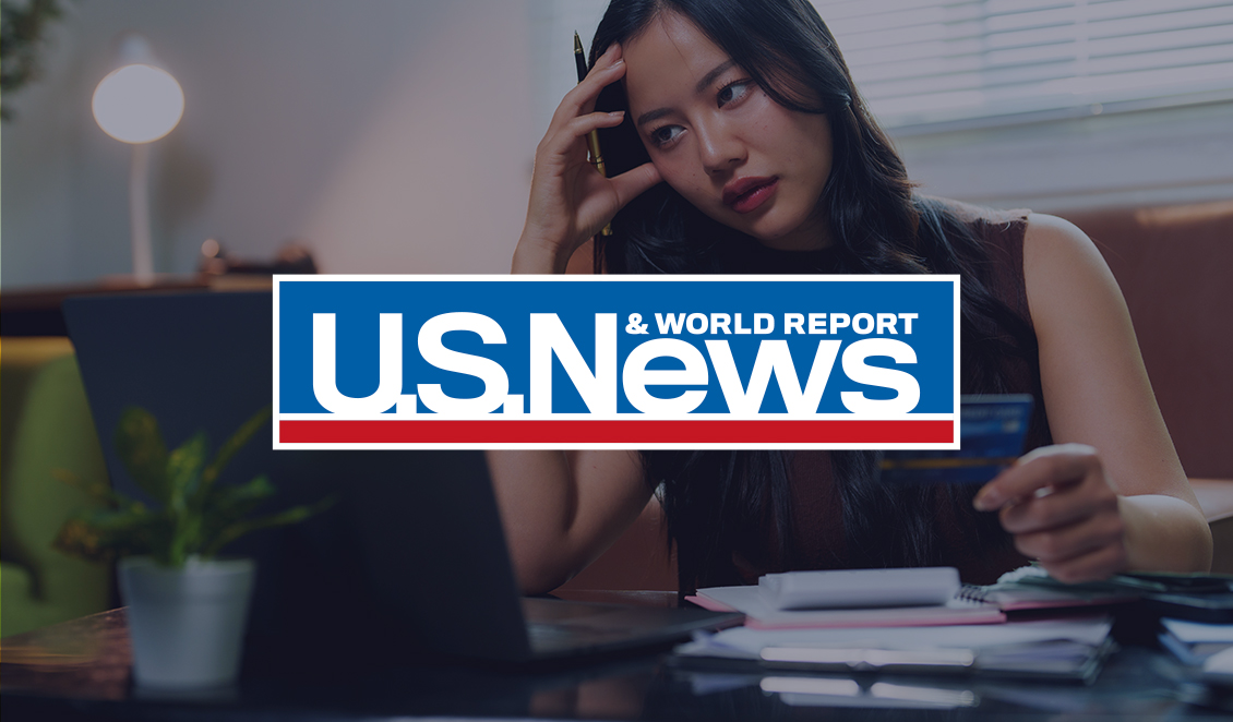 U.S. News & World Report logo over an image of a woman reviewing her credit card and finances on her laptop