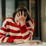 Senior couple meeting with a financial advisor and reviewing information on a tablet.