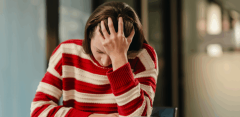 Senior couple meeting with a financial advisor and reviewing information on a tablet.