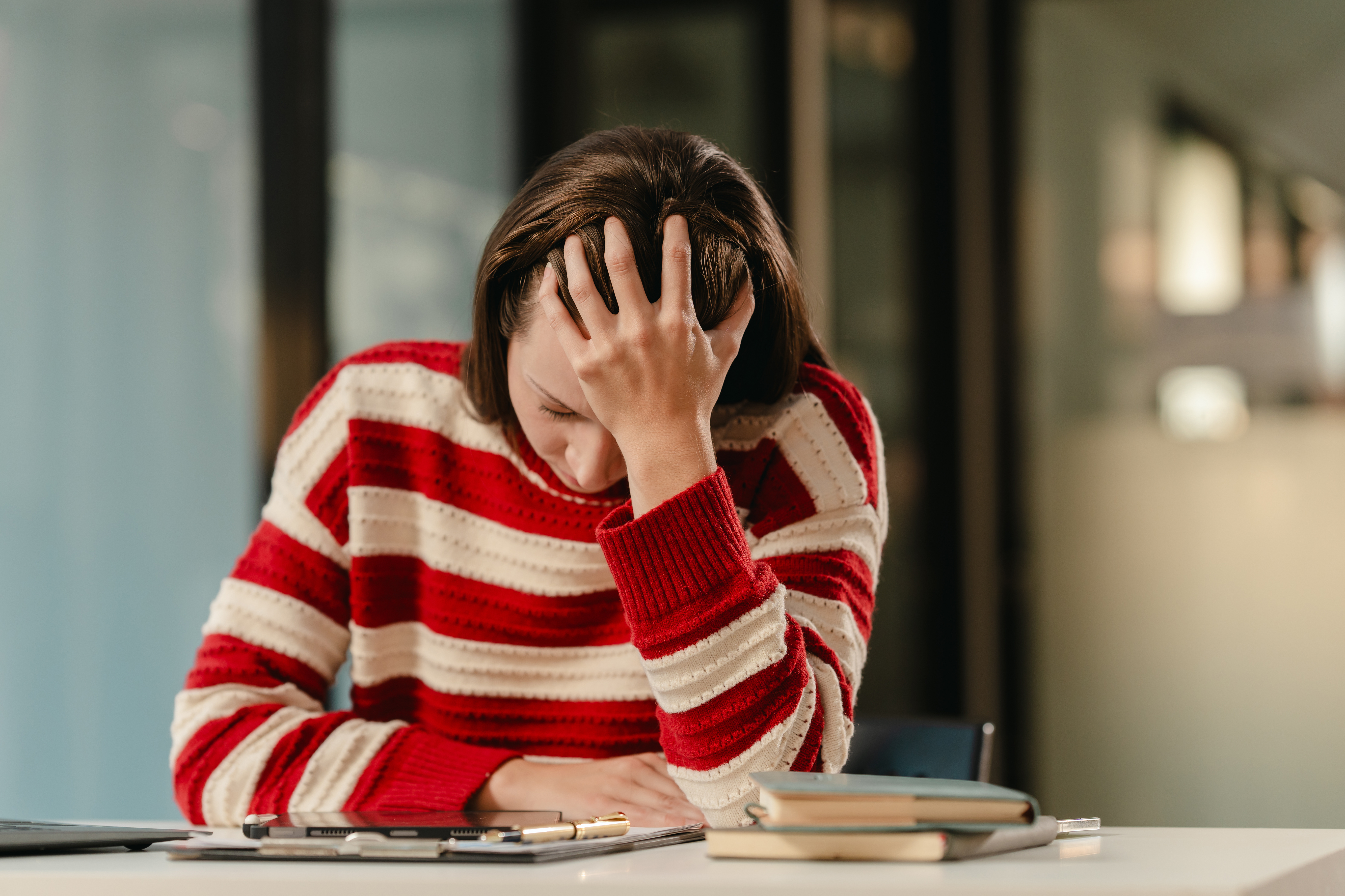 Senior couple meeting with a financial advisor and reviewing information on a tablet.