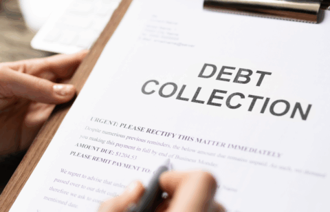 A person holds a clipboard with a document labeled “Debt Collection.”