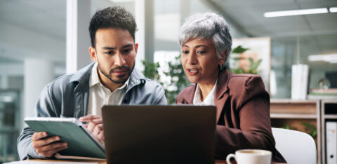 Creative people, tablet and laptop in office for planning, fact check and help with editor feedback. Staff, team and advice with tech for research, article comparison and information for publication