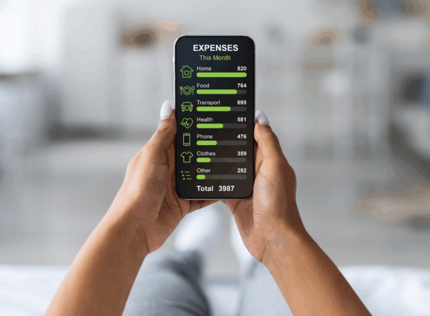 Person holding a smartphone that displays a monthly expense breakdown, including housing, food, transportation, health, phone, clothing, and other costs.